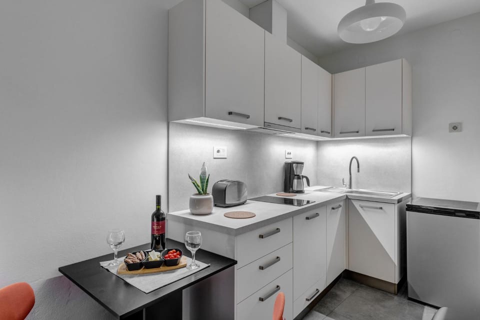 Kitchen or kitchenette, stove, toaster
