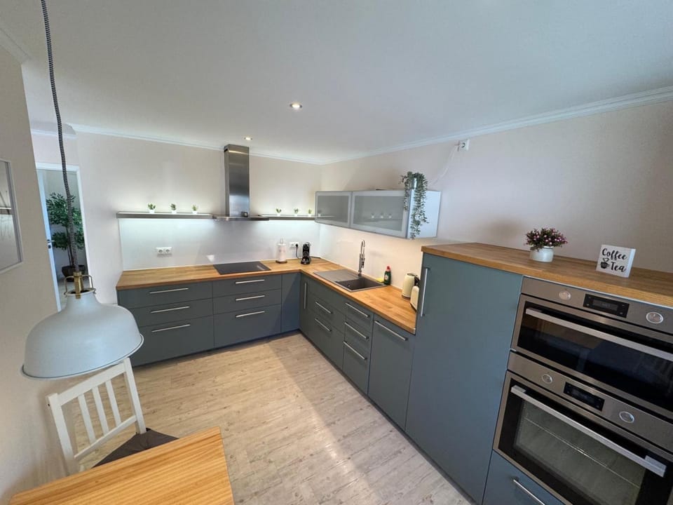 Kitchen or kitchenette, dishwasher, oven, stove, toaster