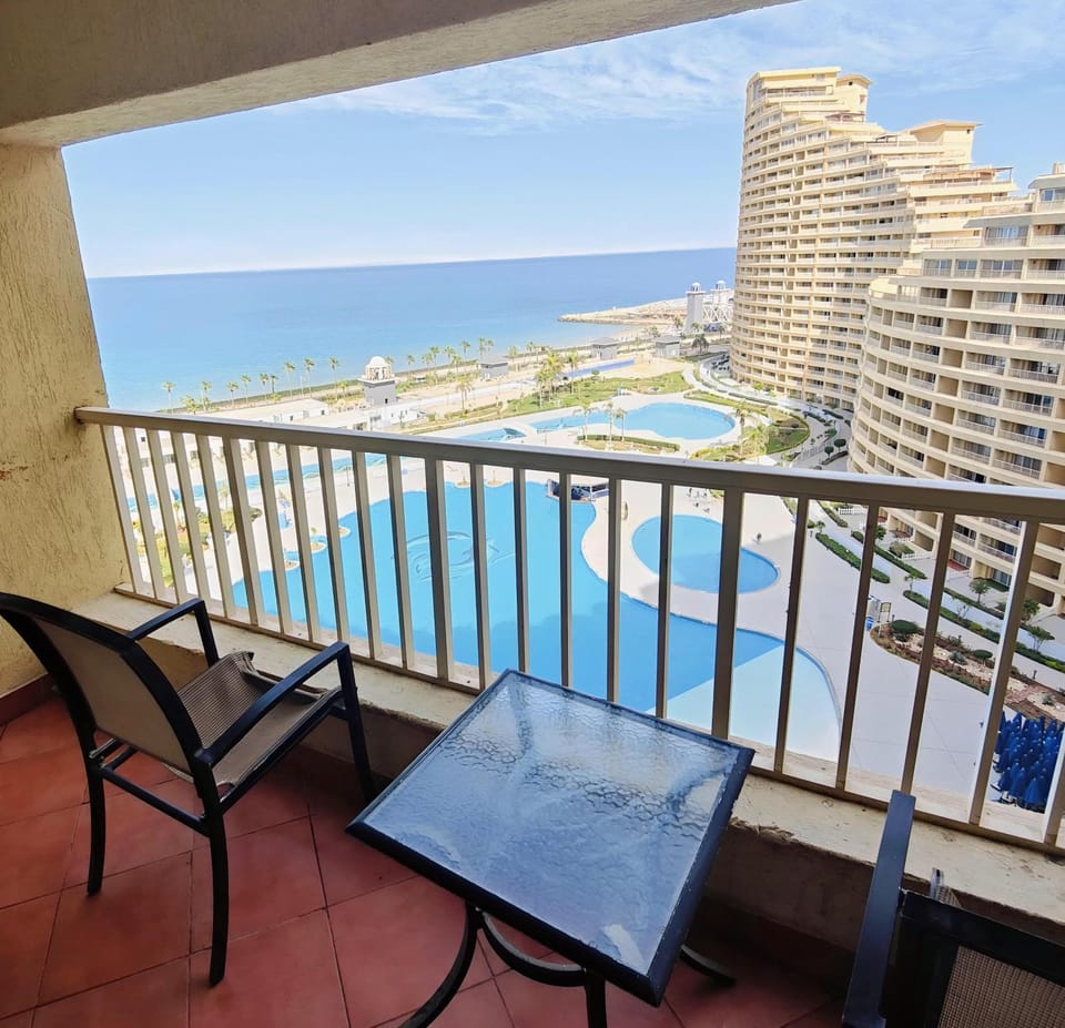 Property building, Day, Natural landscape, View (from property/room), Balcony/Terrace, Living room, Seating area, Pool view, Sea view, Swimming pool