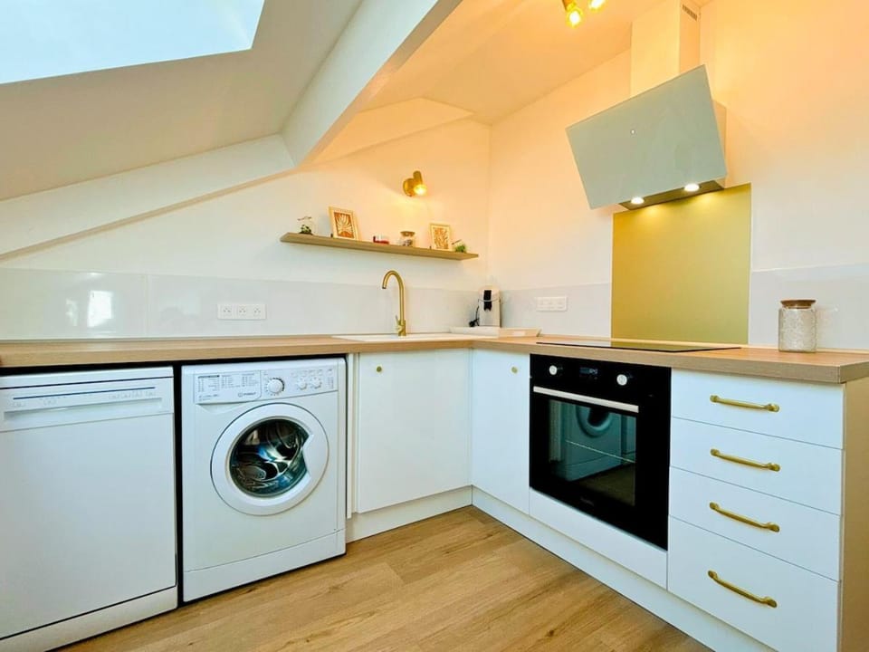 Kitchen or kitchenette, dishwasher, oven, stove, washing machine