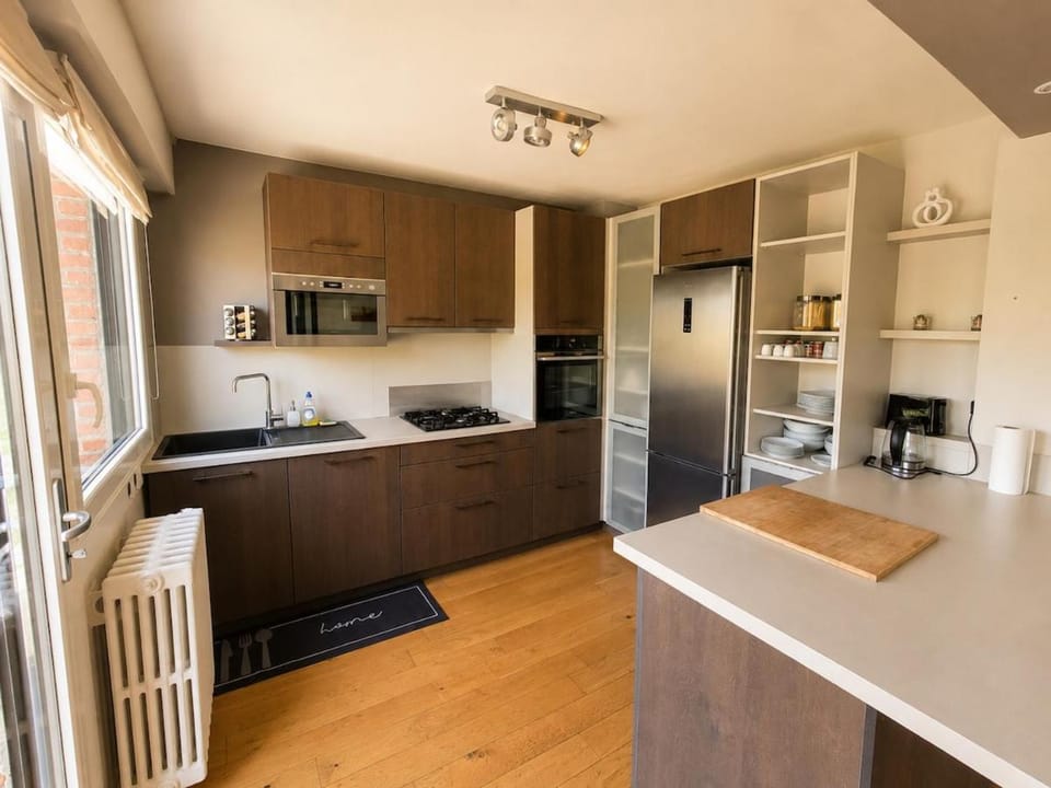 Kitchen or kitchenette, dishwasher, oven, stove