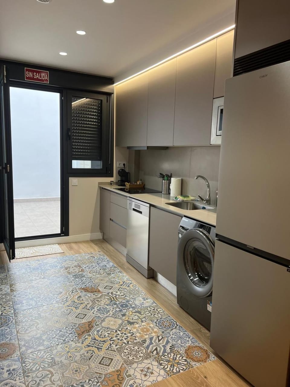 Kitchen or kitchenette, dishwasher, stove, washing machine