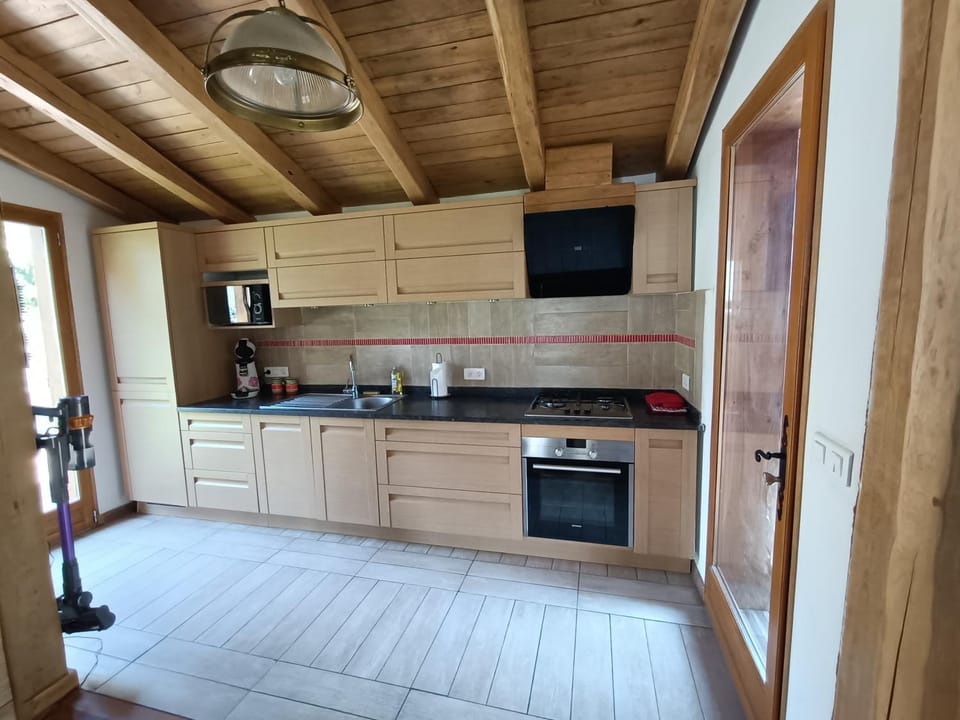 Kitchen or kitchenette, dishwasher, oven, stove