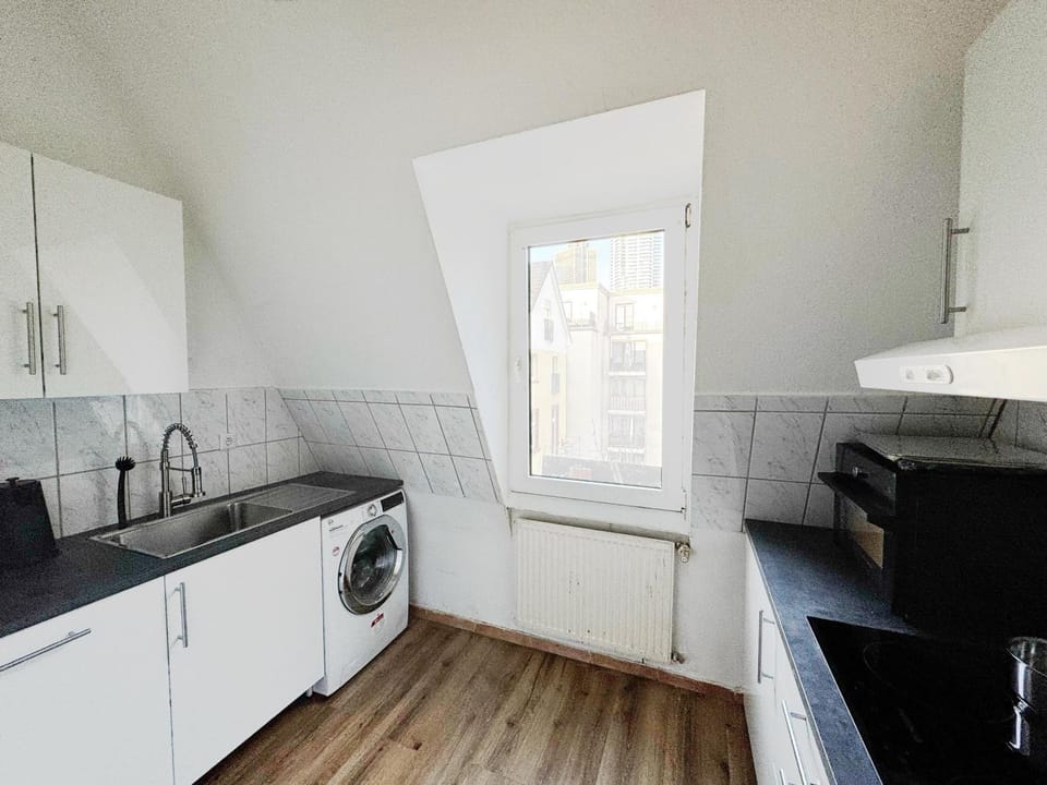 Kitchen or kitchenette, dishwasher, stove, washing machine