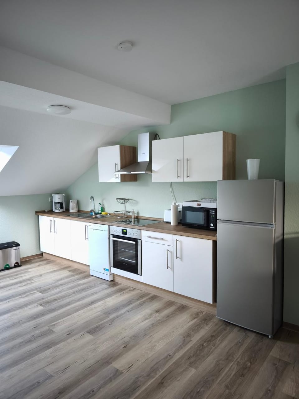 Kitchen or kitchenette, dishwasher, microwave, oven, stove, toaster