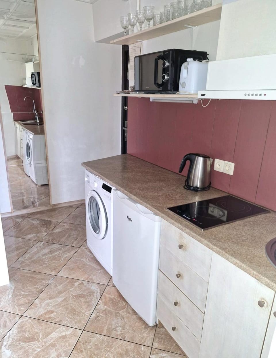 Kitchen or kitchenette, washing machine