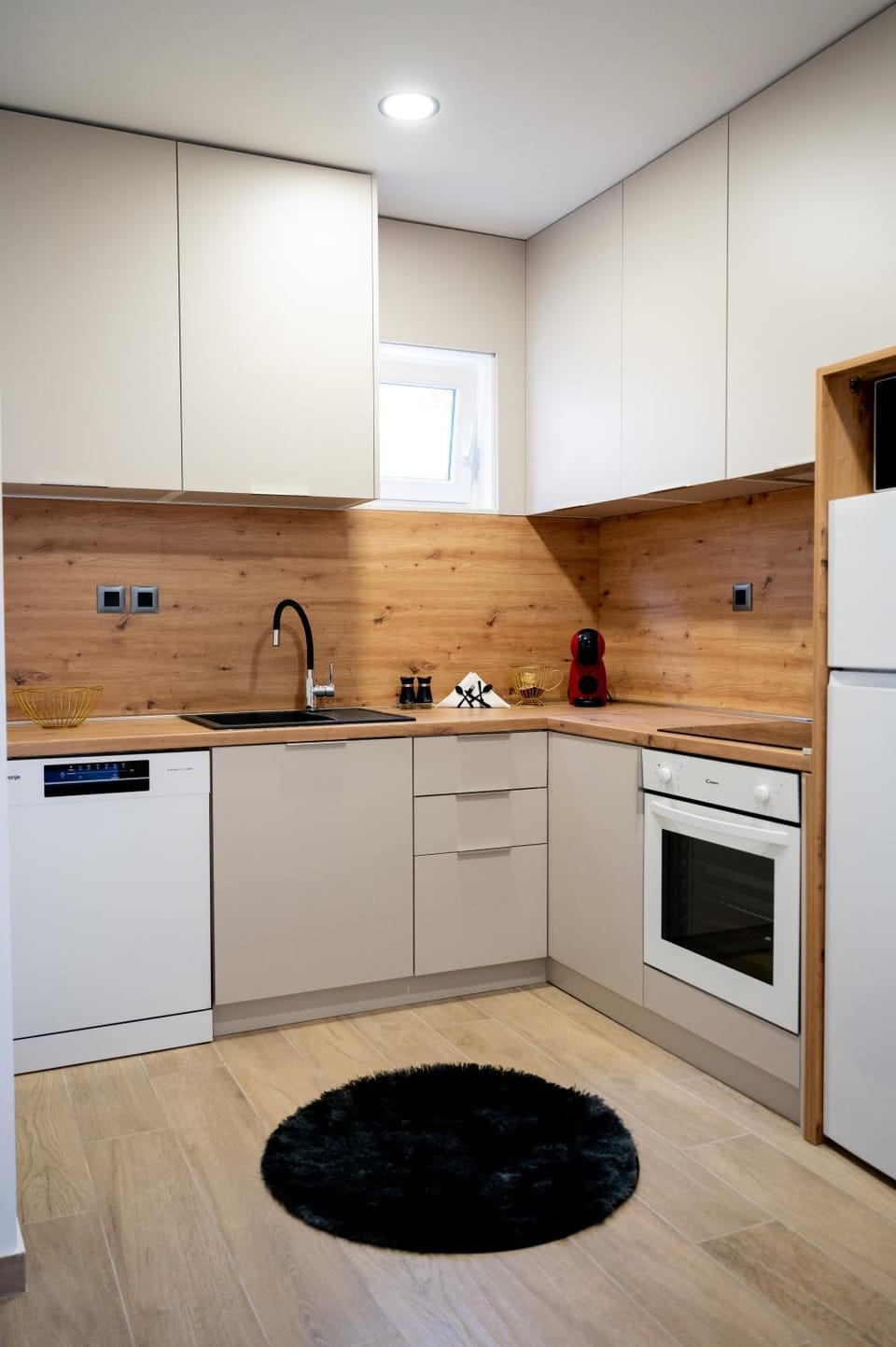 Kitchen or kitchenette, dishwasher, oven, stove
