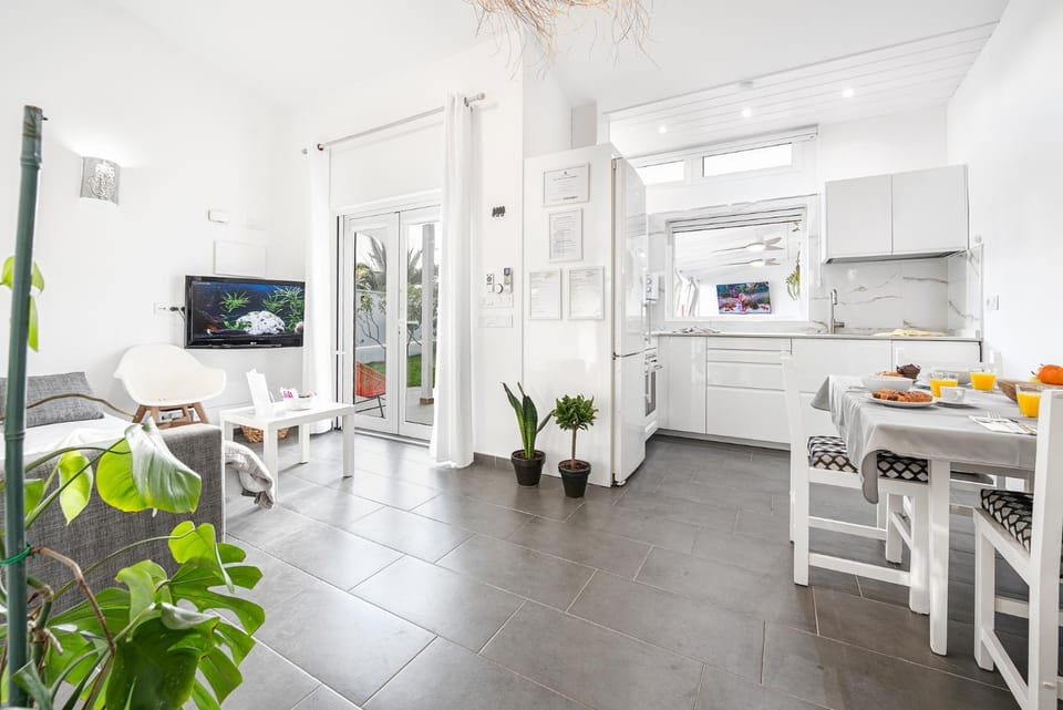 TV and multimedia, Kitchen or kitchenette, Living room, Seating area, Dining area, Garden view, air conditioner