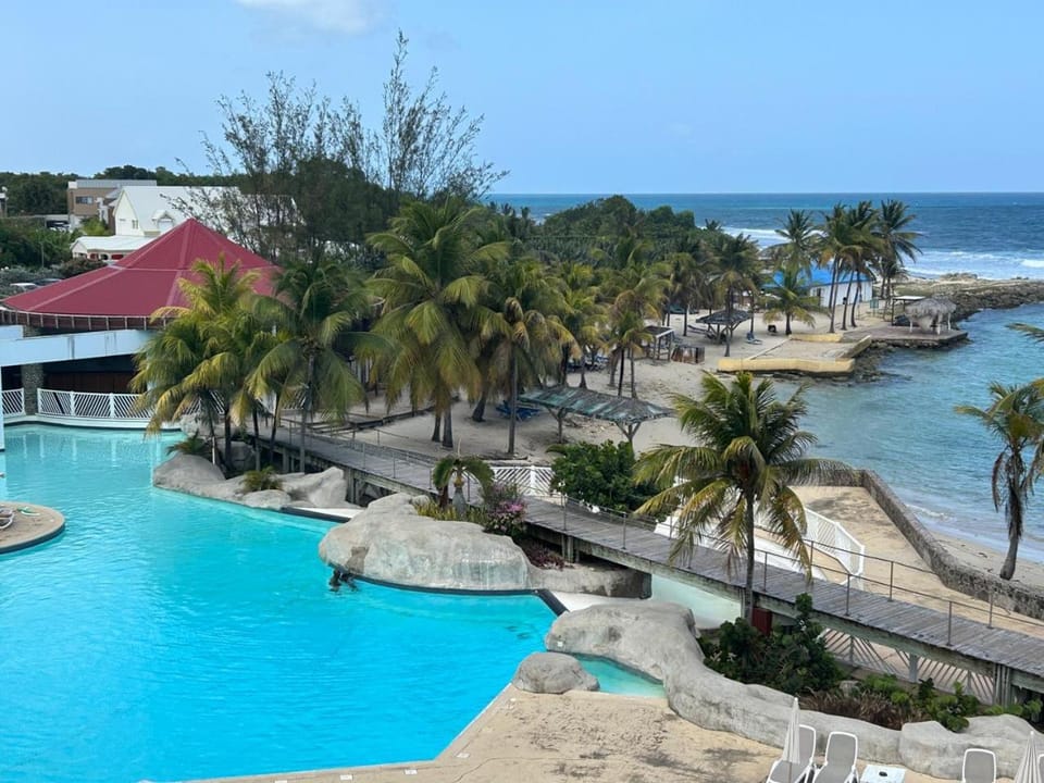 Le Nid d'Amour Créole - Studio romantique avec accès au lagon et à la piscine XXL de 1 000 m2 - Saint-François Apartment in Grande-Terre, Guadeloupe