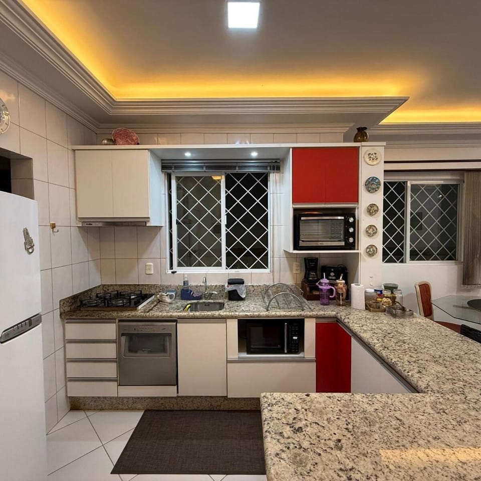 Kitchen or kitchenette, dishwasher, microwave, oven, stove