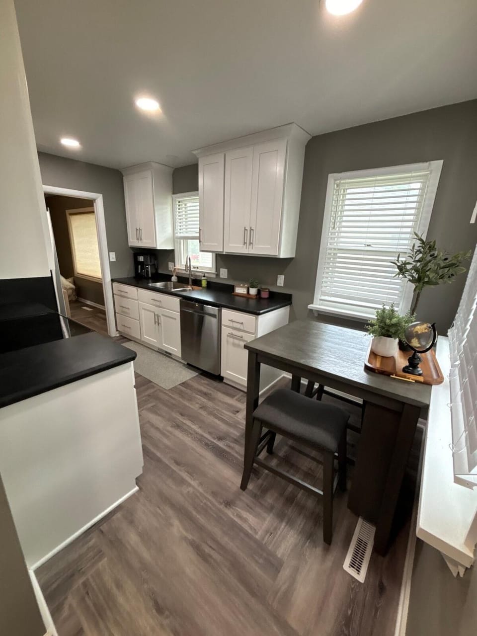 Kitchen or kitchenette, dishwasher, oven, stove