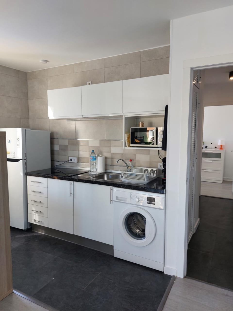 Kitchen or kitchenette, stove, washing machine