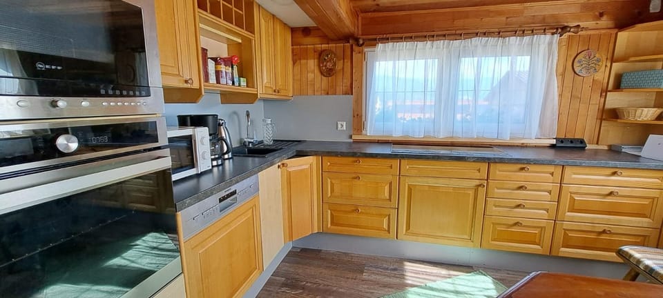 Kitchen or kitchenette, microwave, oven, stove