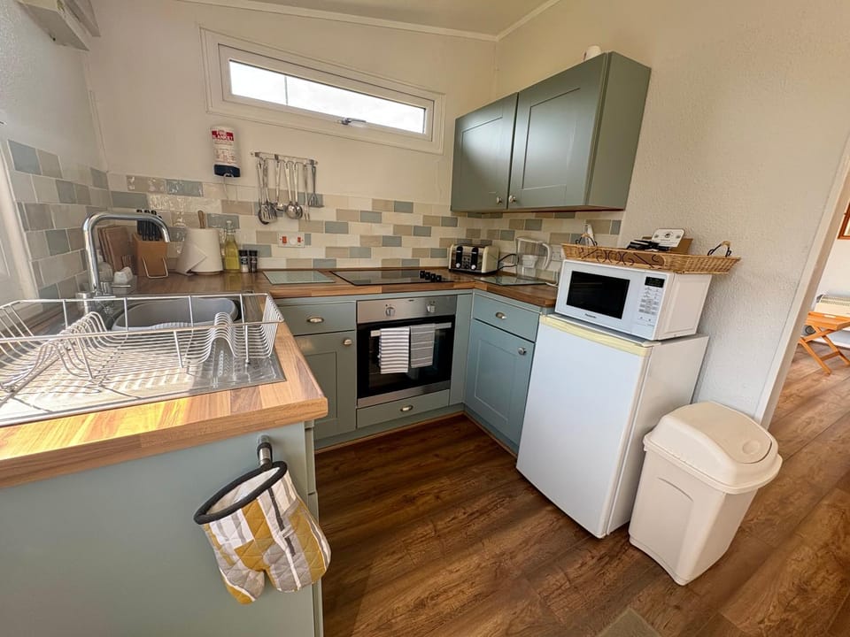 Kitchen or kitchenette, oven, stove, toaster