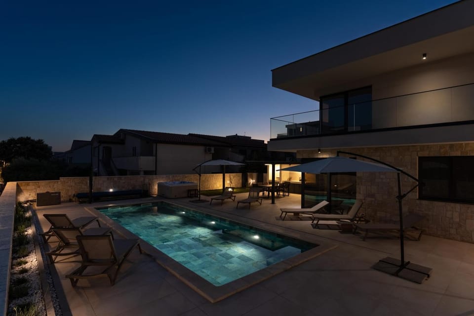 Property building, Night, Pool view, Swimming pool, sunbed