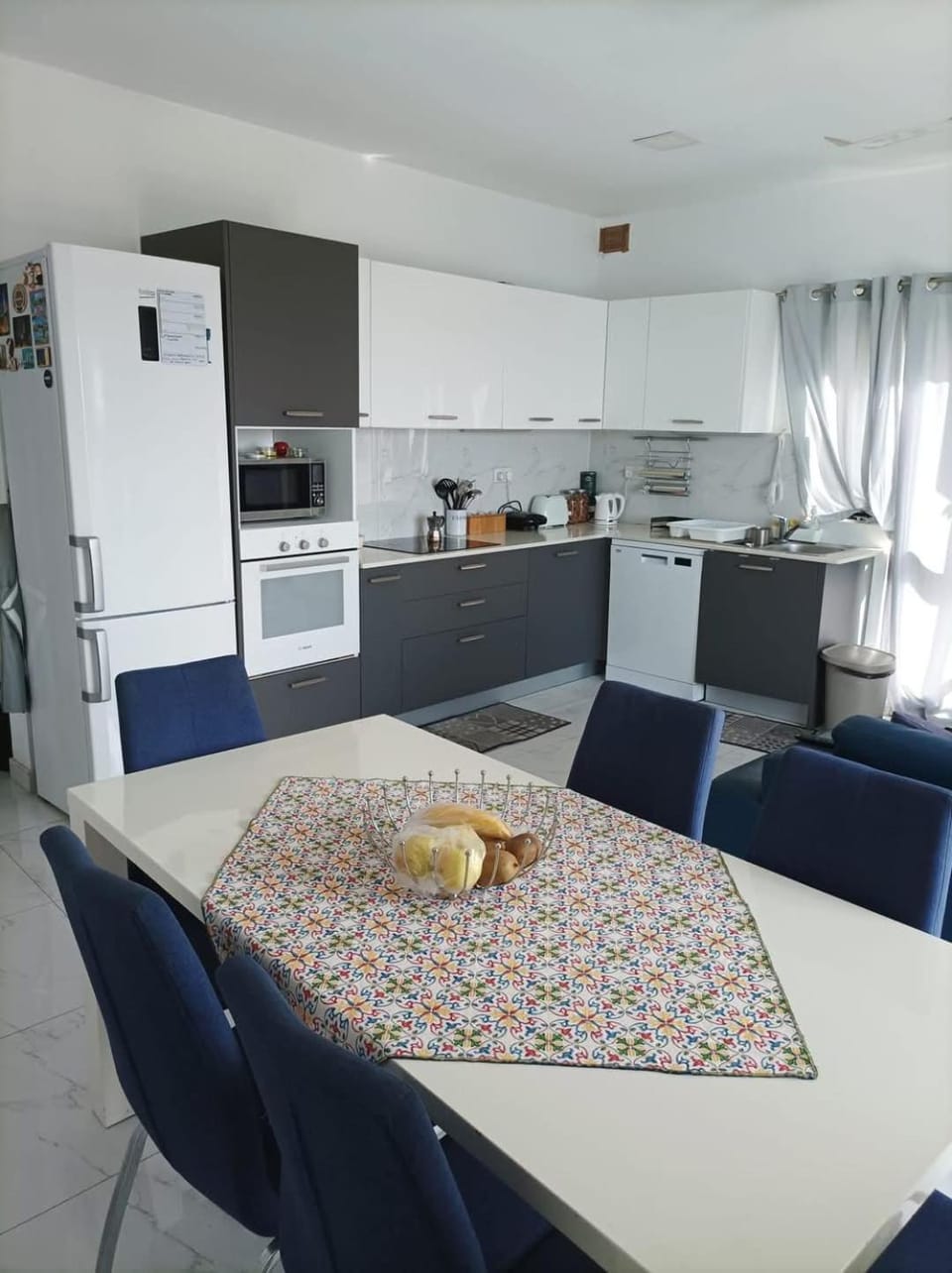 Kitchen or kitchenette, Living room, Dining area, dishwasher, oven, stove, toaster, air conditioner