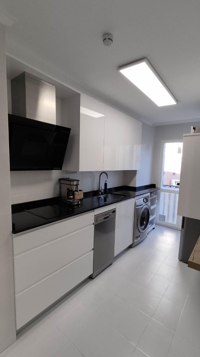 Kitchen or kitchenette, dishwasher, oven, stove, washing machine