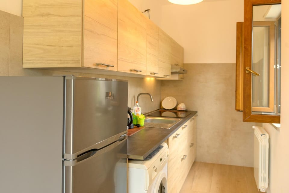 Kitchen or kitchenette, oven, stove, washing machine
