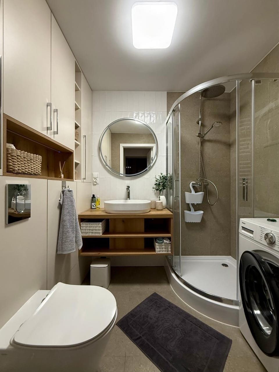 Shower, Toilet, Bathroom, towels, washing machine, dryer