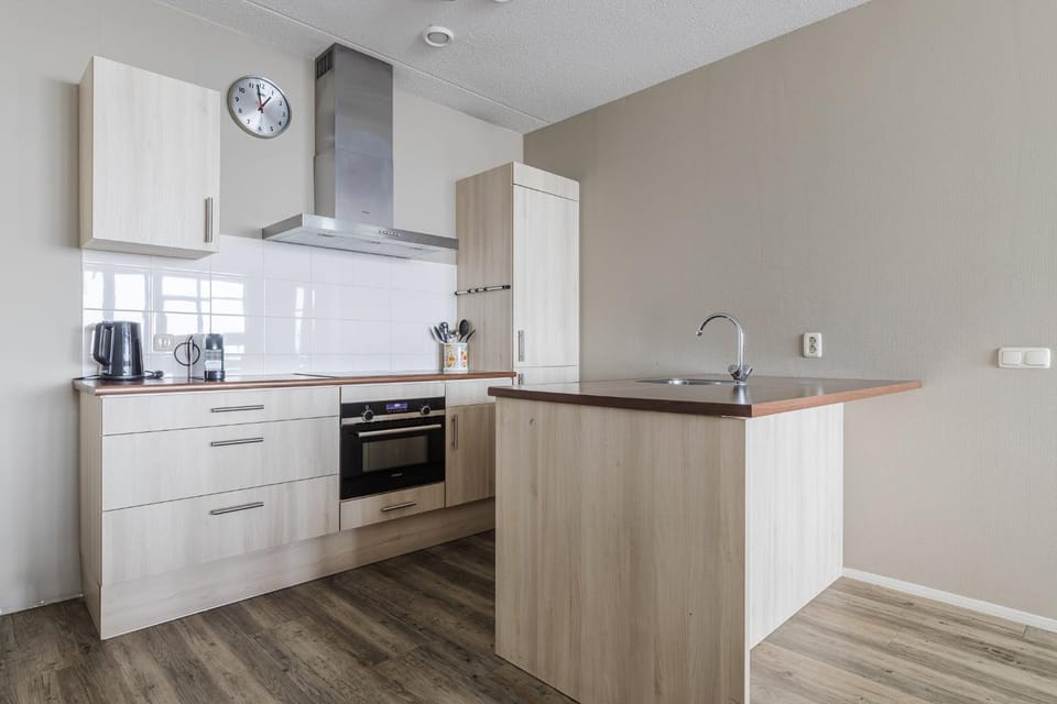 Kitchen or kitchenette, dishwasher, oven, stove, toaster