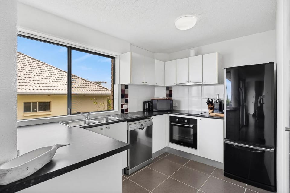 Kitchen or kitchenette, dishwasher, oven, stove, toaster