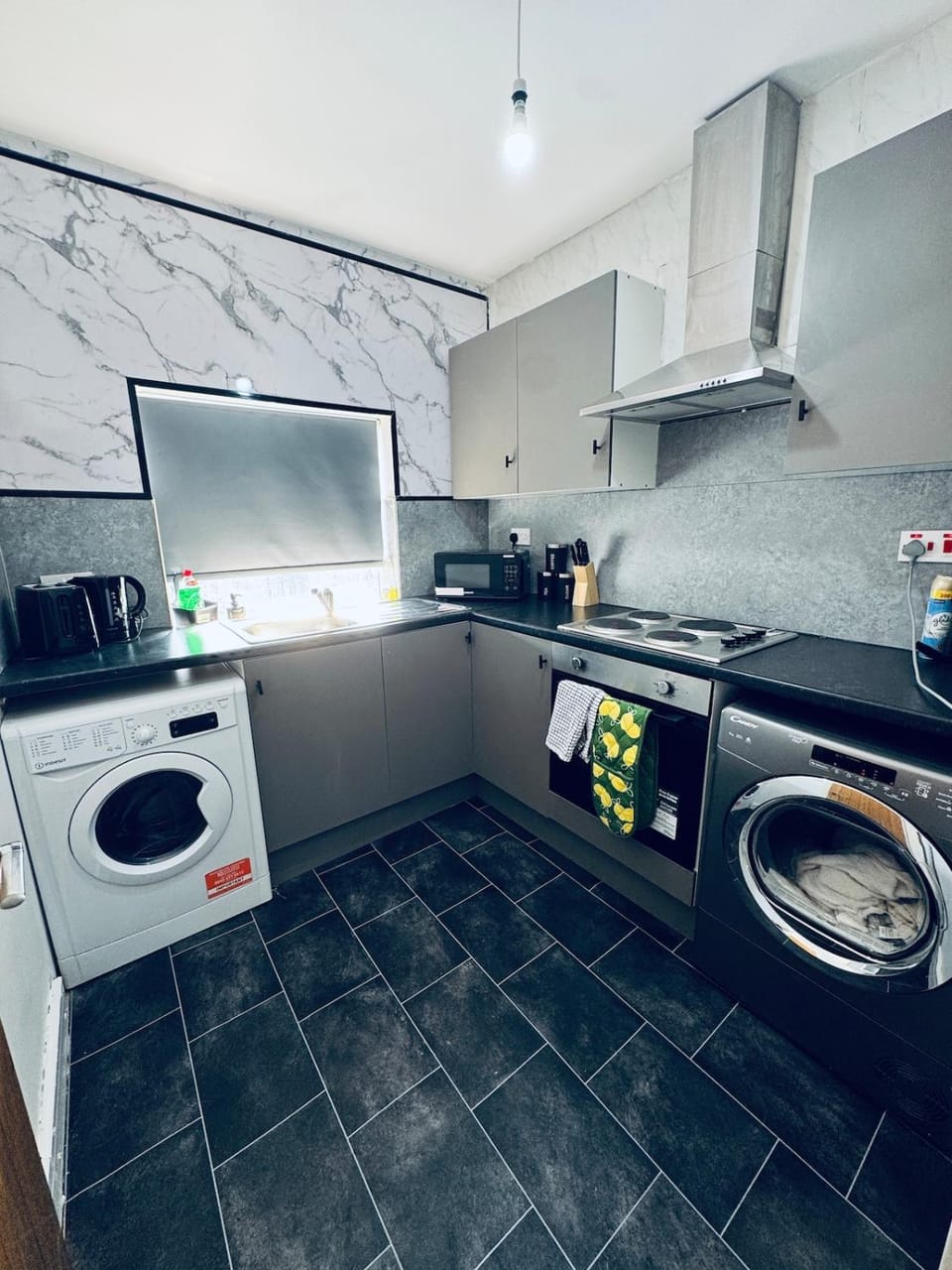 Kitchen or kitchenette, oven, stove, toaster, washing machine, dryer