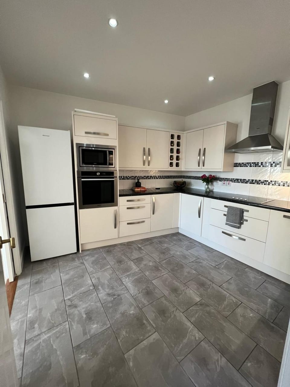 Kitchen or kitchenette, dishwasher, microwave, oven