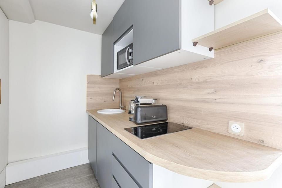 Kitchen or kitchenette, stove, toaster