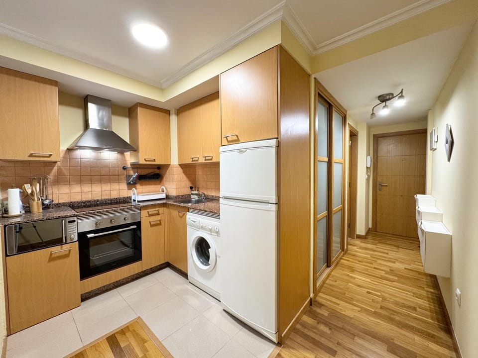 Kitchen or kitchenette, microwave, oven, stove, washing machine, kitchen
