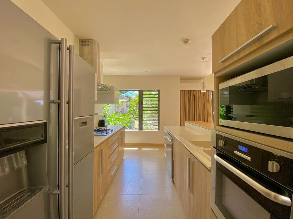 Kitchen or kitchenette, dishwasher, oven, stove