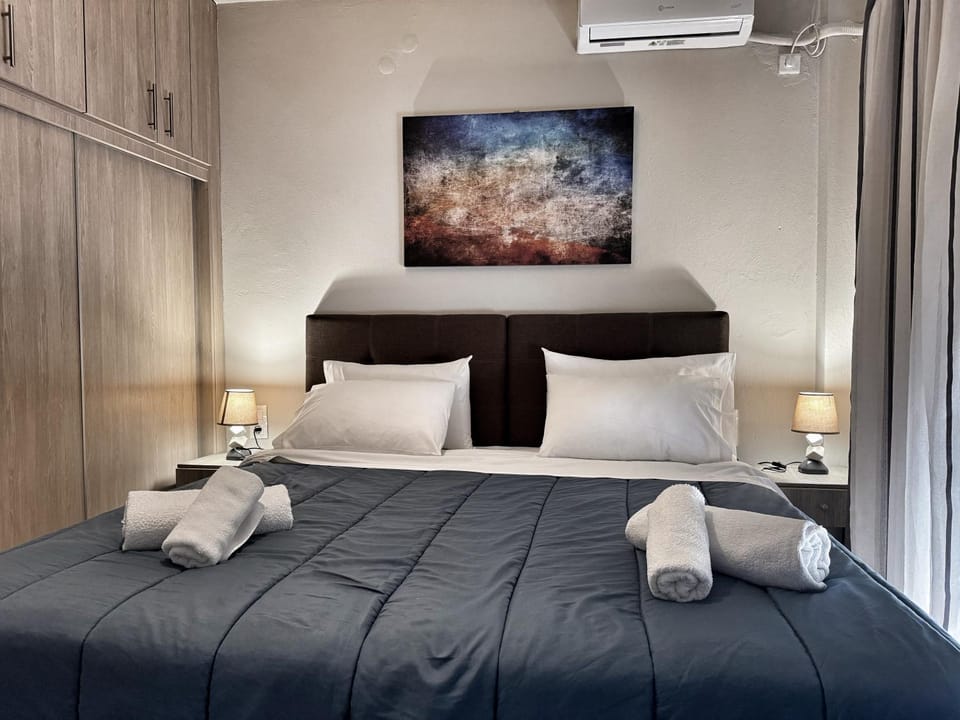 Photo of the whole room, Bedroom, towels, air conditioner