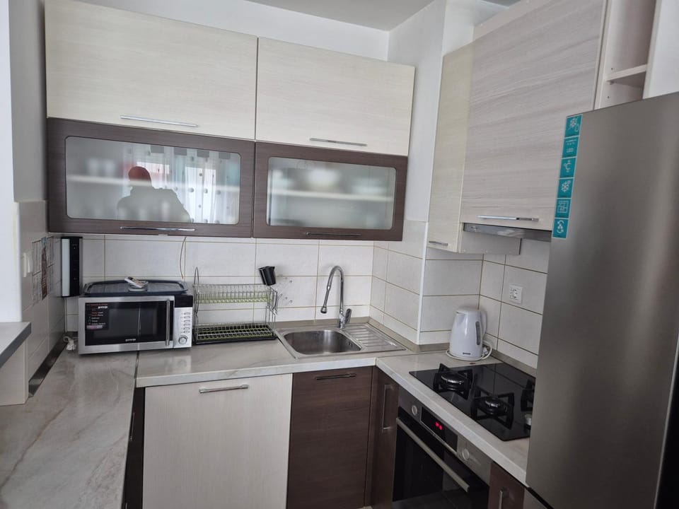 Kitchen or kitchenette, dishwasher, microwave, oven, stove