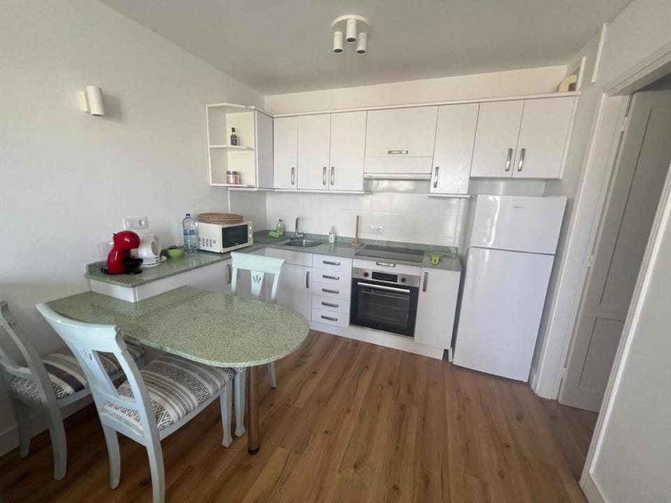 Kitchen or kitchenette, oven, stove, toaster