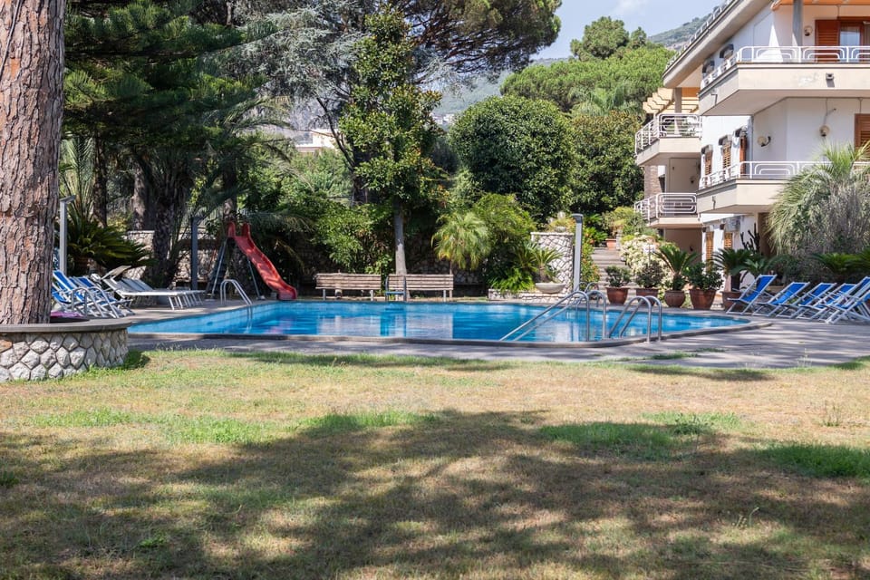 Property building, Patio, Spring, Natural landscape, Garden, Garden view, Pool view, Swimming pool, sunbed
