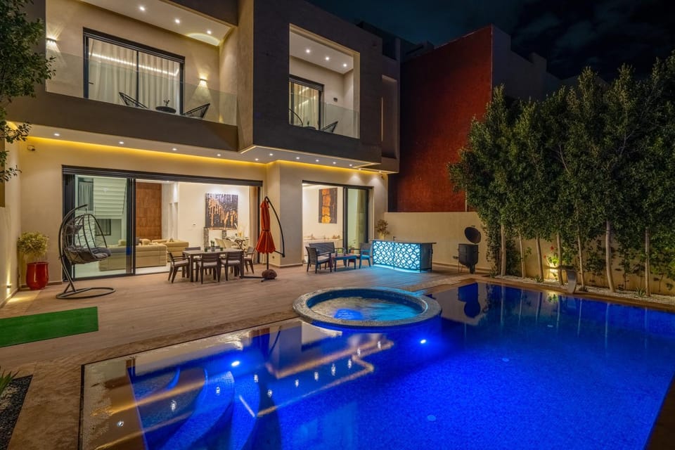 Property building, Patio, Night, Pool view, Swimming pool, sunbed