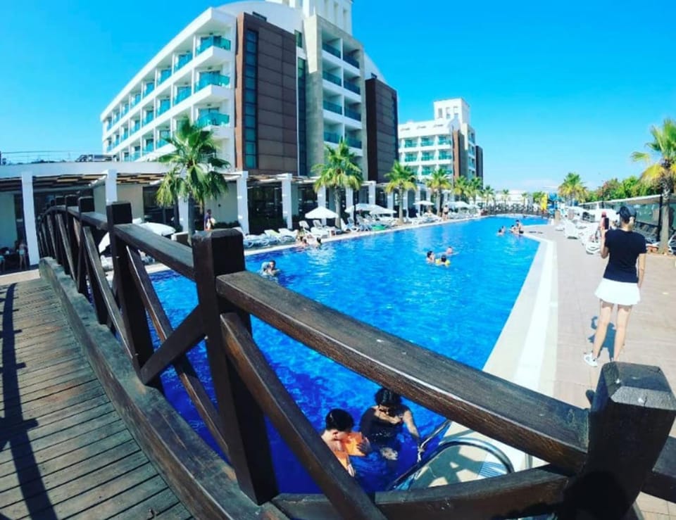 Property building, People, Swimming pool, sunbed