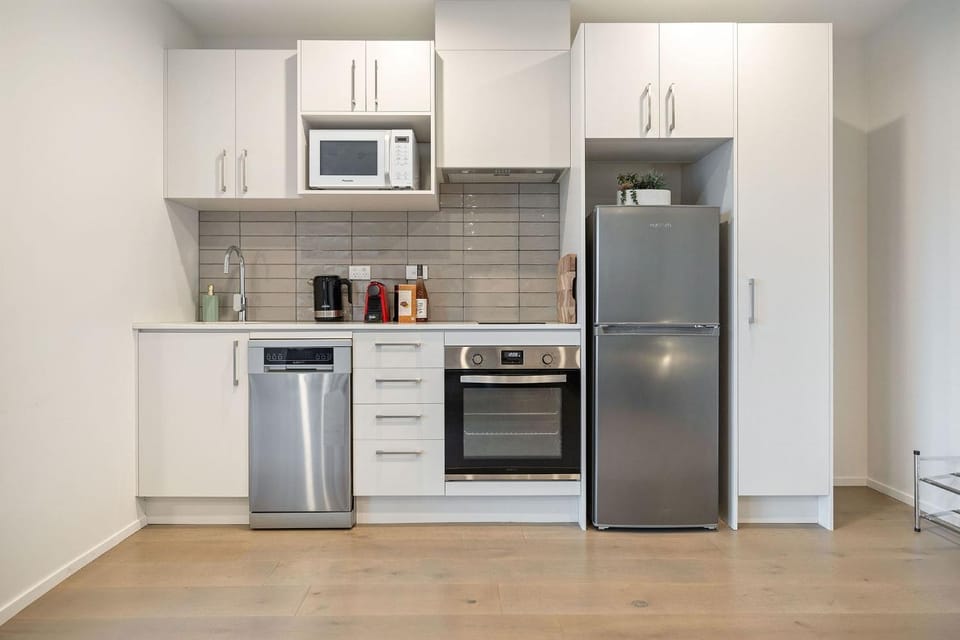 Kitchen or kitchenette, dishwasher, oven, stove, toaster