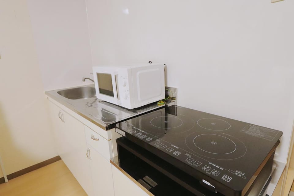 Kitchen or kitchenette, stove