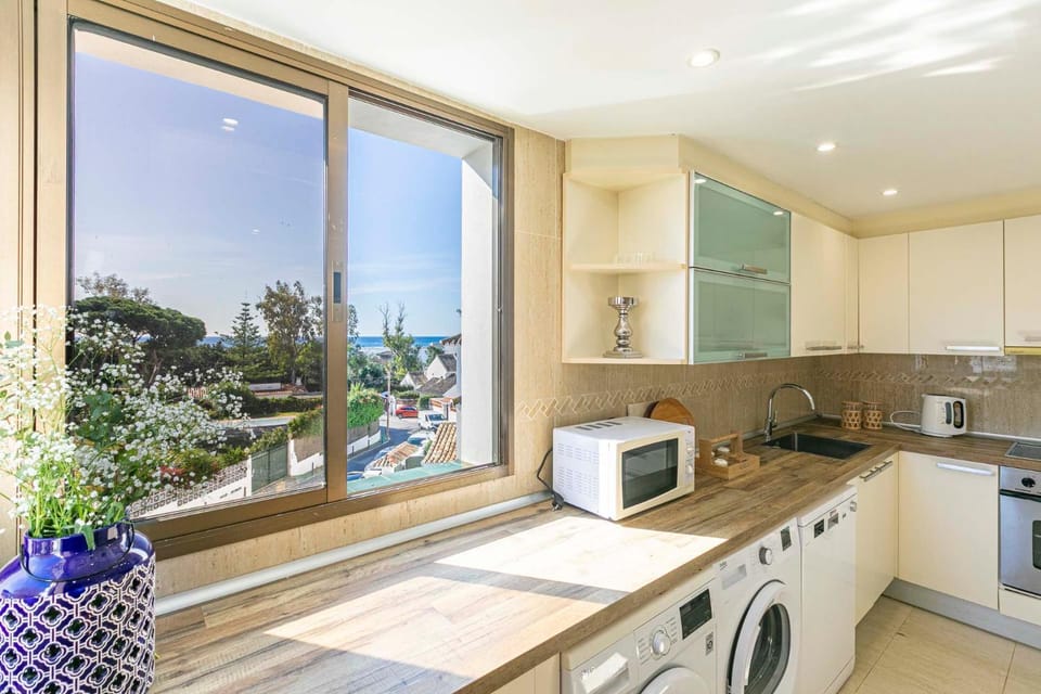 Kitchen or kitchenette, dishwasher, oven, stove, washing machine