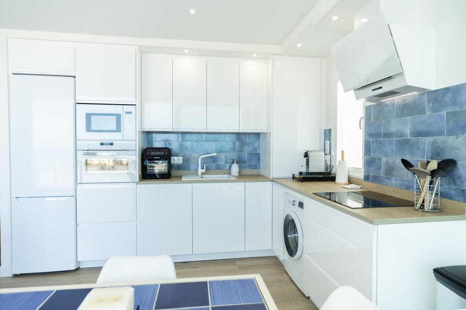 Kitchen or kitchenette, dishwasher, oven, stove, toaster