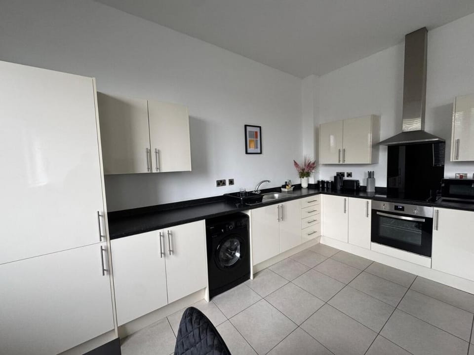 Kitchen or kitchenette, dishwasher, oven, stove, toaster