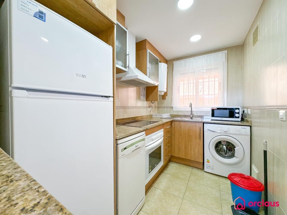 Kitchen or kitchenette, dishwasher, oven, stove, washing machine