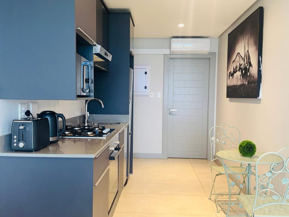 Kitchen or kitchenette, Dining area, oven, stove, toaster, air conditioner
