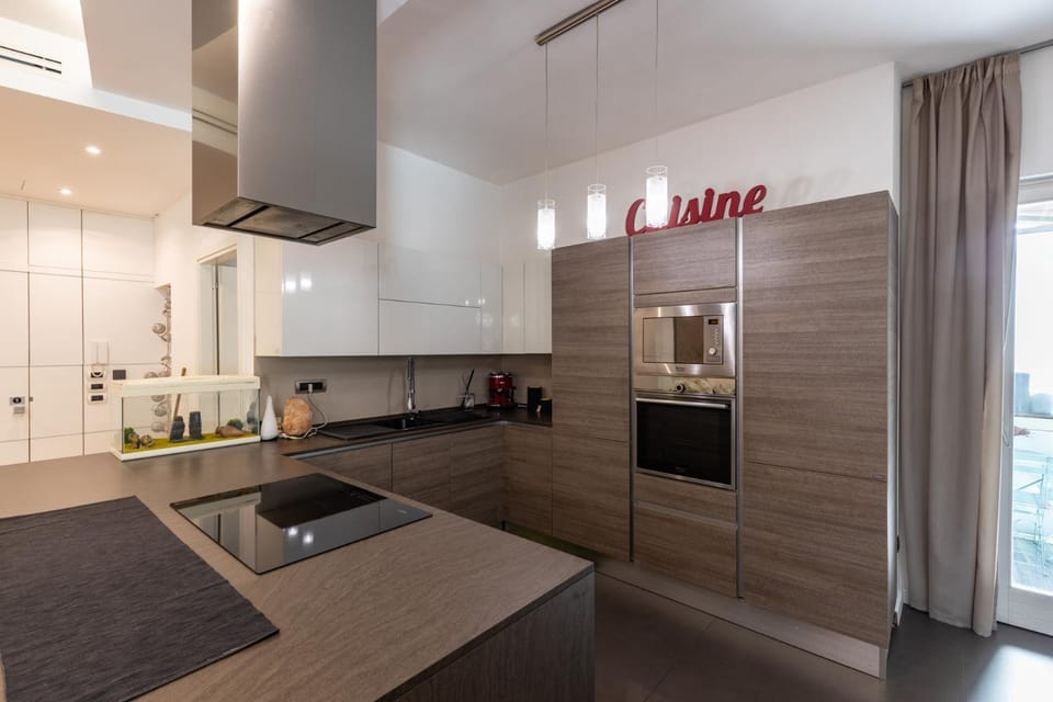 Kitchen or kitchenette, dishwasher, oven, stove