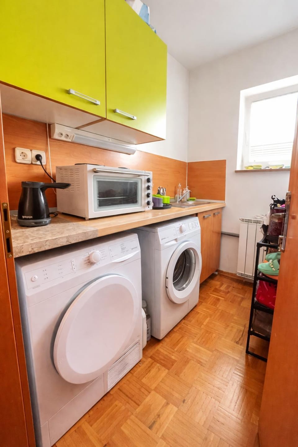 Kitchen or kitchenette, Dining area, dishwasher, stove, washing machine