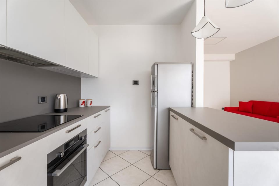 Kitchen or kitchenette, dishwasher, oven, stove