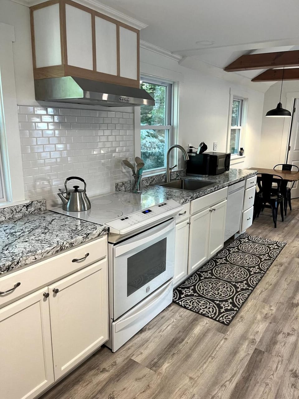 Kitchen or kitchenette, dishwasher, oven, stove