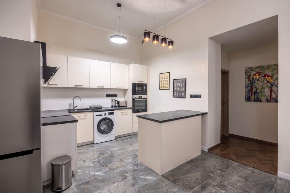 Kitchen or kitchenette, dishwasher, oven, stove, washing machine