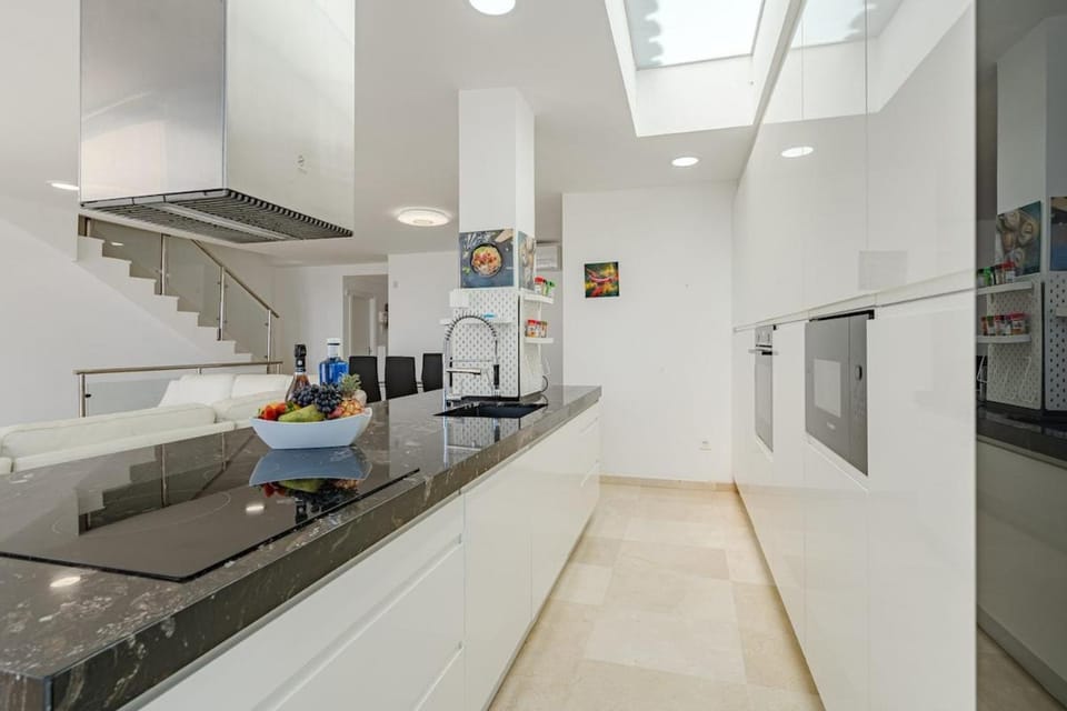 Kitchen or kitchenette, dishwasher, oven, stove