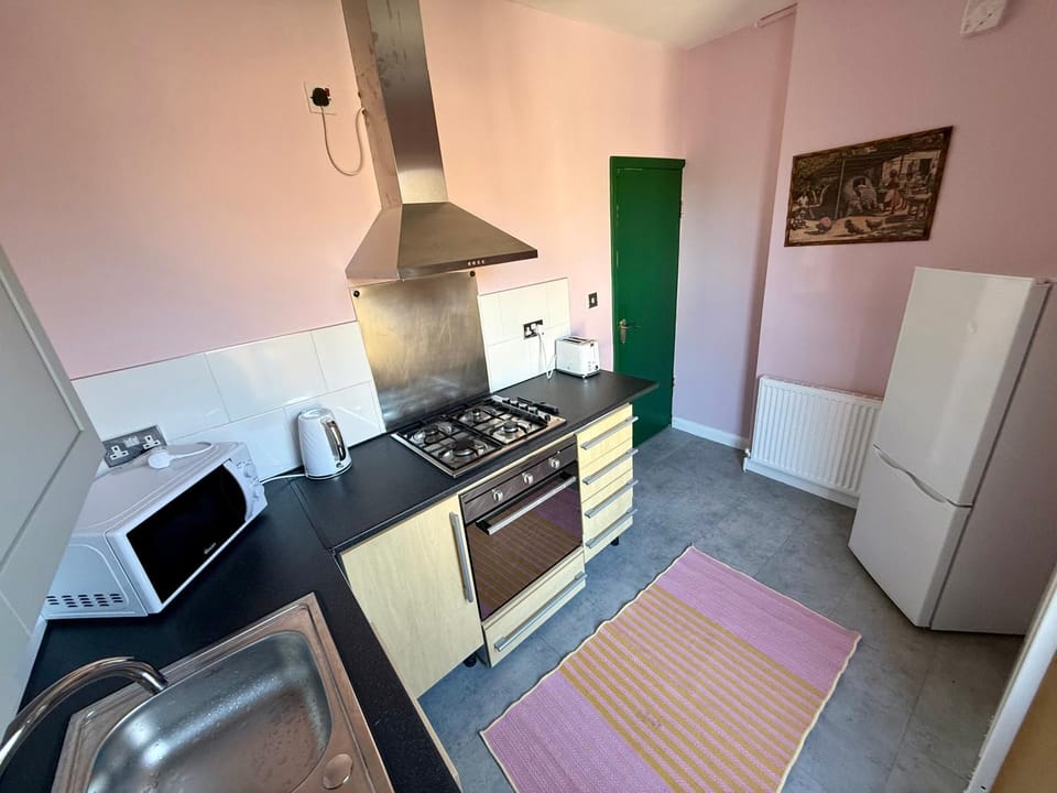 Kitchen or kitchenette, microwave, oven, stove, toaster